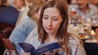 Trainee looking at the Center bulletin
